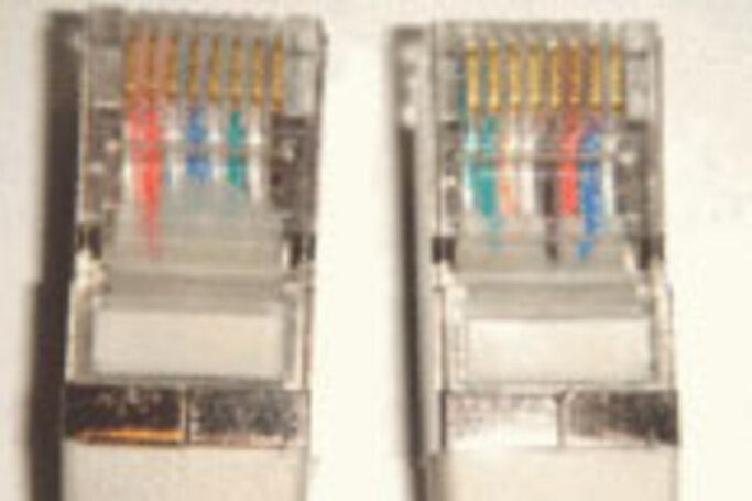 The distinguishing features of a crossover cable are the two plug ends with twisted wires.