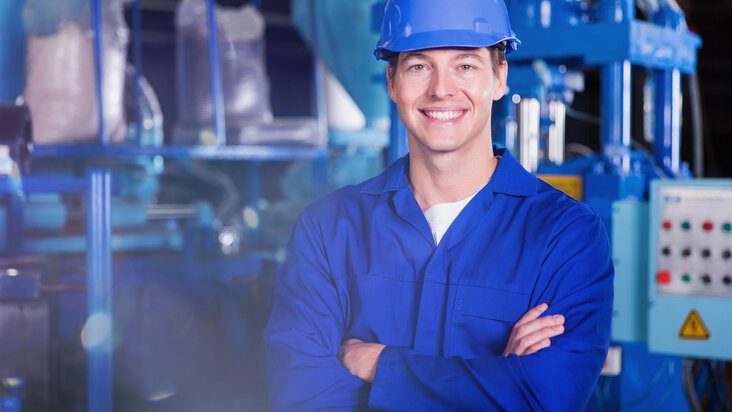 Engineer in front of industrial plant